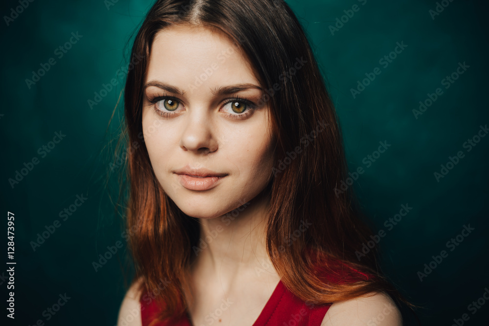 elegant red-haired lady on a green background elegant red-haired lady on a green background