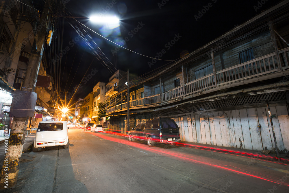 Fototapeta premium Night street old commercial building at Mae Sot, Tak, Thailand