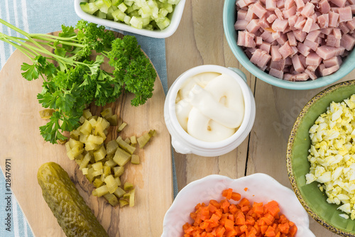 Ingredients for traditional russian olivier salad with ham veget