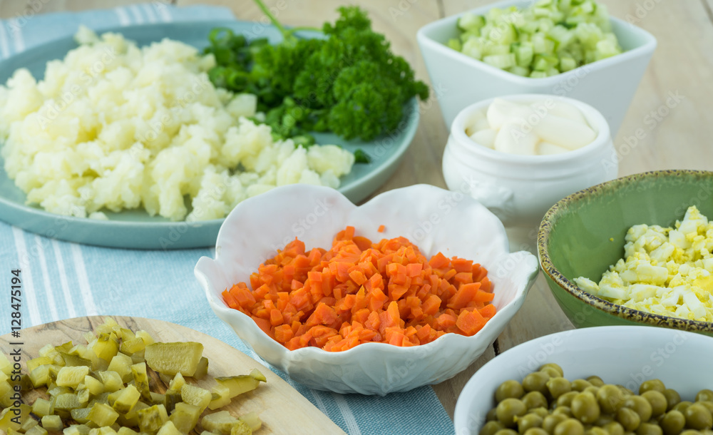 Ingredients for traditional russian olivier salad with ham veget Ingredients for traditional russian olivier salad with ham veget