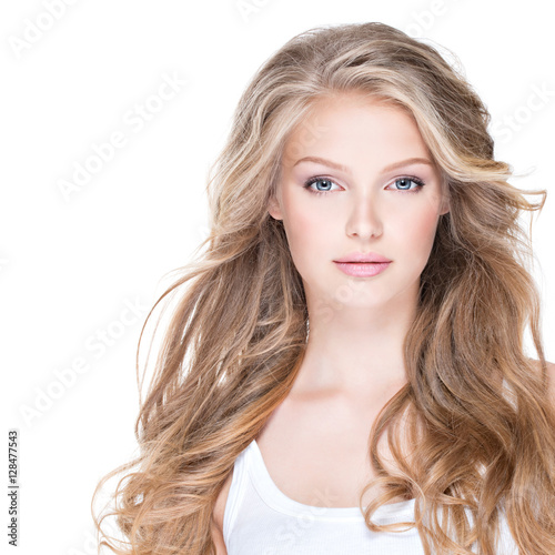 Beautiful happy woman with long curly hair.