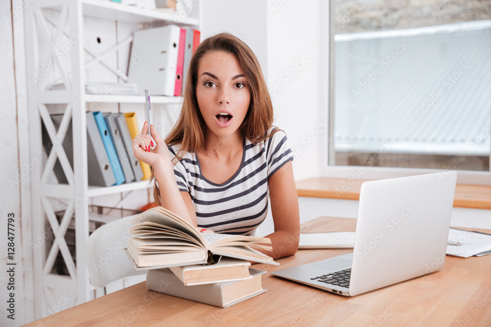 Incredible female student have an idea while sitting at classroom Incredible female student have an idea while sitting at classroom