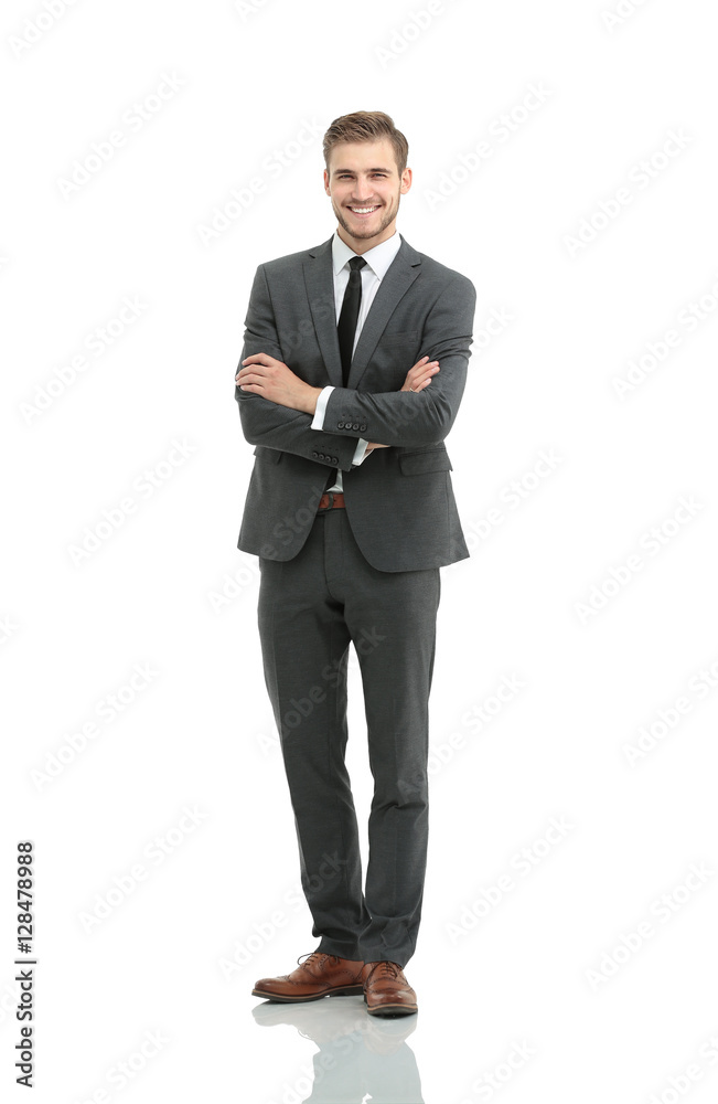 portrait in full length of a smiling young businessman with a st