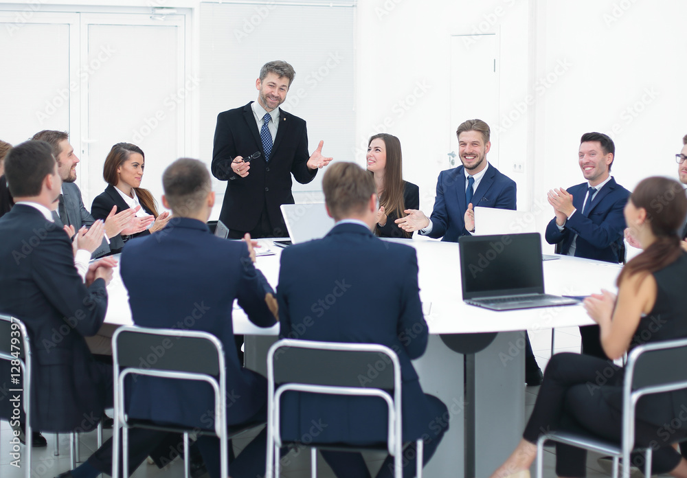 Businesspeople Sitting At Conference Round Table At The Meeting