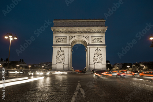 Triumphal arch. Paris. France. View Place Charles de Gaulle. Famous touristic architecture landmark in summer night. Napoleon victory monument. Symbol of french glory. World historical heritage. Toned