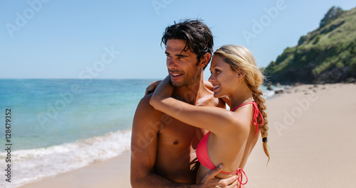 Affectionate young couple embracing on the beach © Jacob Lund