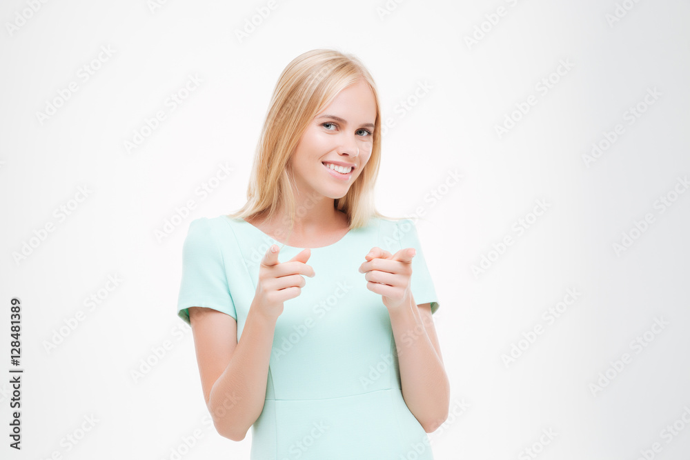 Attractive young woman pointing to the camera Attractive young woman pointing to the camera