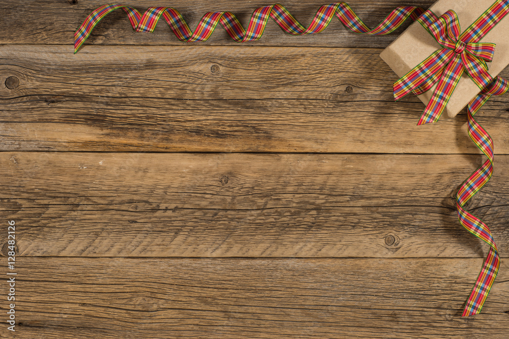 Fototapeta premium Gift box on an old wooden table.