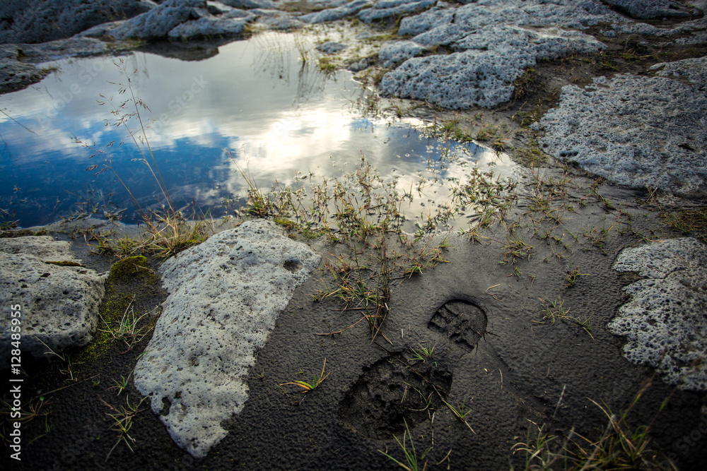 Trace of men's shoes in the mud. Iceland.