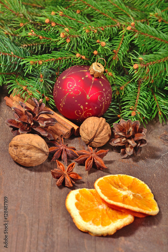 Different kinds of spices, nuts, cones and dried oranges, Christ