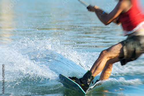 Man on wakeskate doing tricks. Cable Wakeboard. © M-Production
