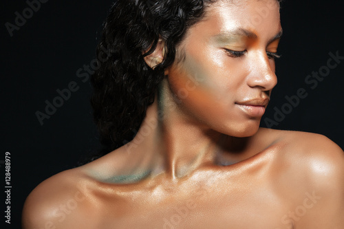 Closeup of sensual african american young woman with shining makeup