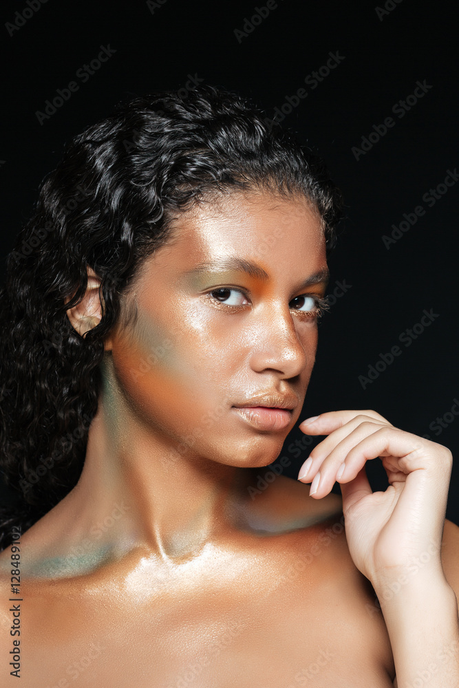 Obraz premium Beauty portrait of beautiful african young woman with fashion makeup