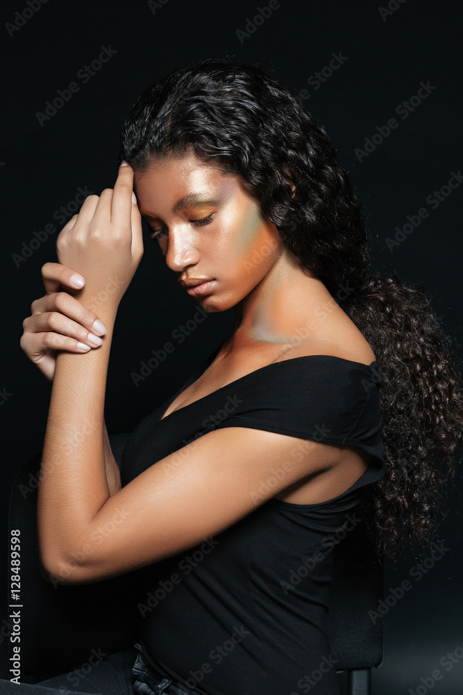 Tender african woman with fasion makeup and long curly hair Tender african woman with fasion makeup and long curly hair