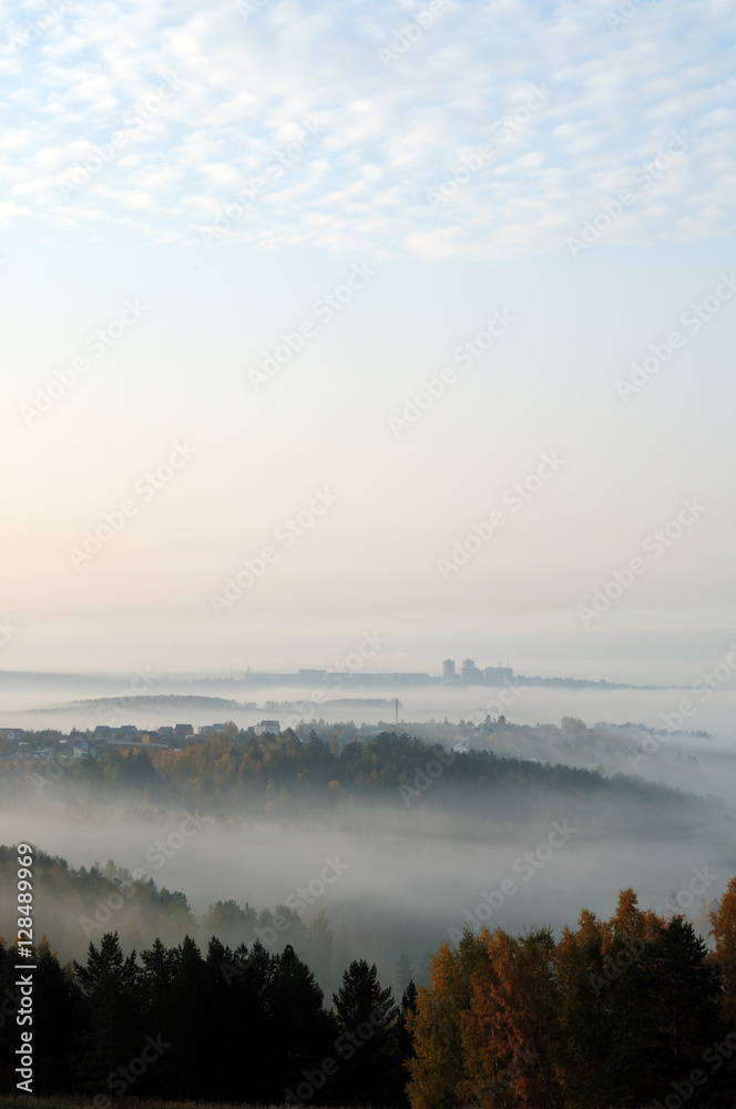  delicate haze of morning mist over the valley. hilly landscape. Savannah, grassland . used toning of the photo