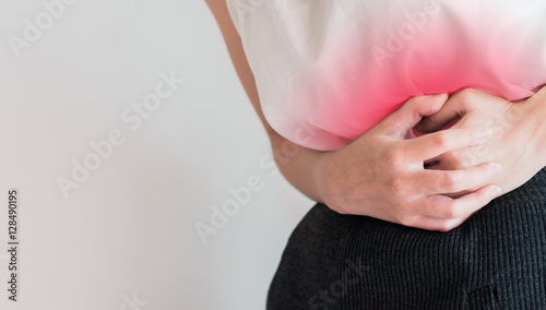 woman stomach ache because of gastritis or menstruation and dige