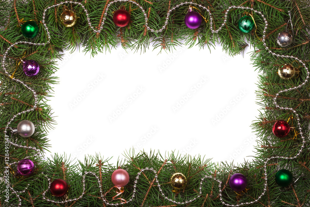 Christmas frame made of fir branches decorated with balls isolated on white background