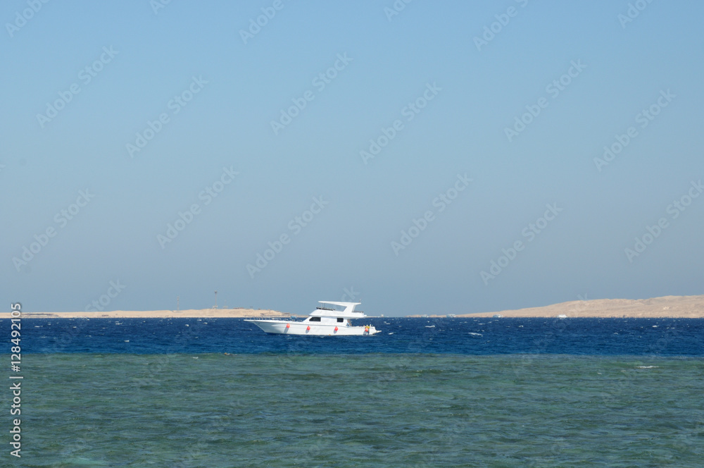 Boat for diving in the lagoon near the island.  Red Sea, The neighborhood of Hurghada, Egypt. Photo toned.