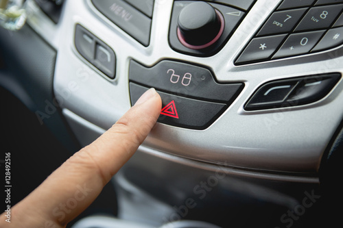 Press the car emergency lights button on dashboard