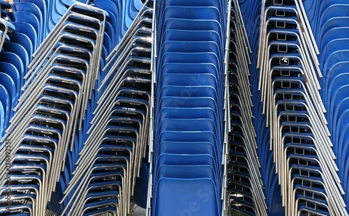 blue chairs stacked horizontal © belleepok