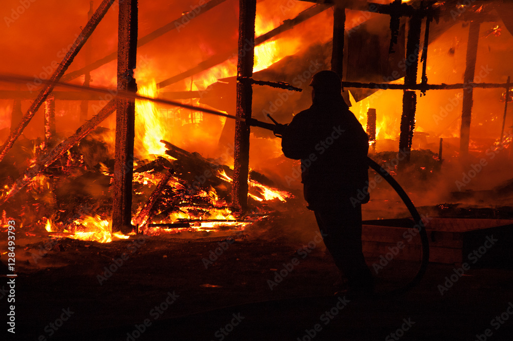 Firefighters extinguish a house