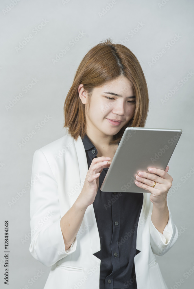 Business woman holding a tablet computer - over a white background Business woman holding a tablet computer - over a white background