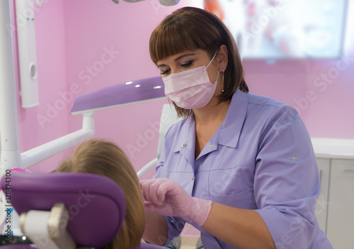 female dentists treating patient