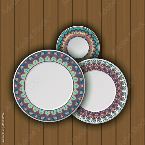 Set of decorative plates with a ethnic tribal ornament of handwork and an empty space in the center.