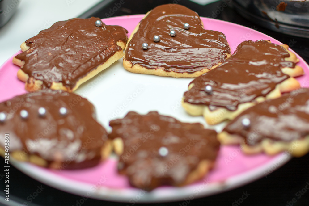 Colorful cookies with icing on a baking sheet Colorful cookies with icing on a baking sheet