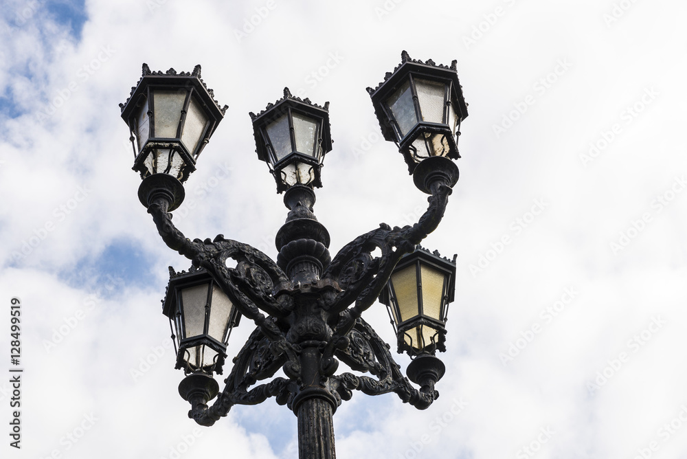 Old black lamppost with five lights