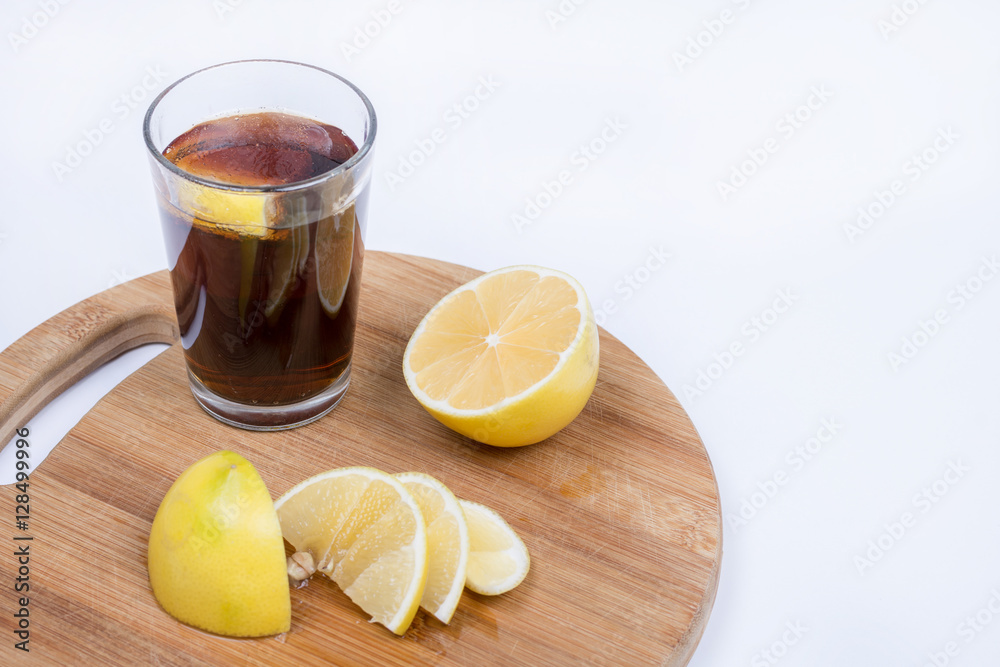 Juice with sliced lemons on the wooden board Juice with sliced lemons on the wooden board