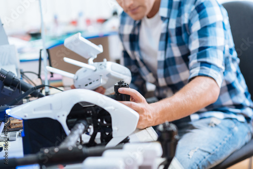 Close up of a man working hard with drone