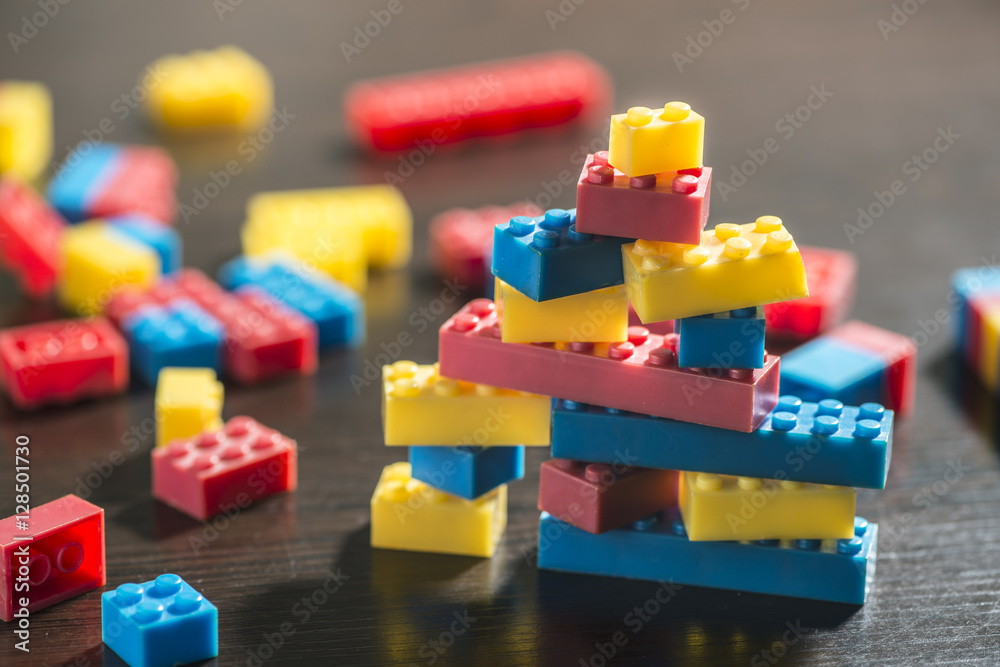 Naklejka premium Plastic blocks on table.