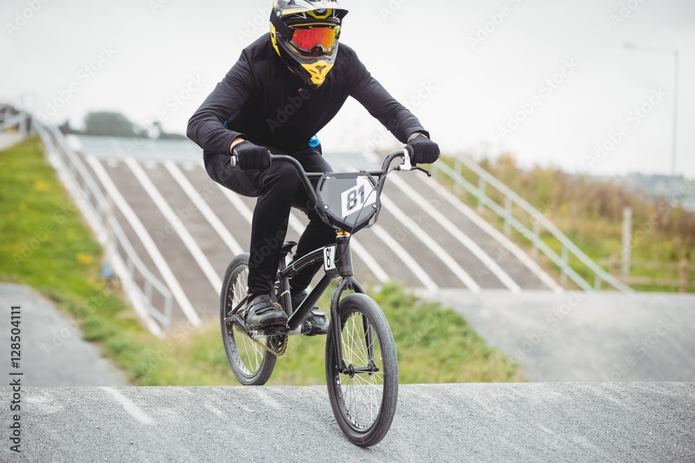 Cyclist riding BMX bike Stock Adobe Stock