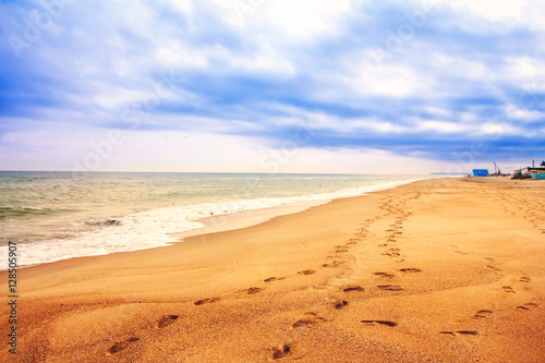 beach footprints in the sand
