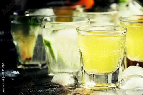 Various cocktails with fruit juice and alcohol, steel background