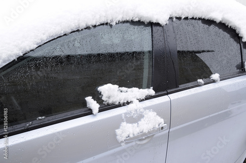 Fall asleep wet snow car. Snowfall of wet snow. Snow lying on the car photo