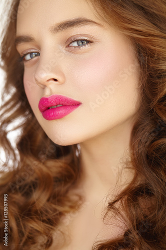 Close-up beauty portrait of girl with pink lips