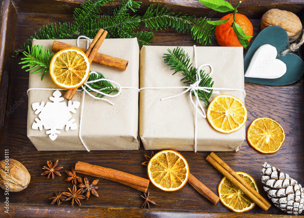 Handmade decorated rustic Christmas gifts with fir tree, cinnamo Handmade decorated rustic Christmas gifts with fir tree, cinnamo