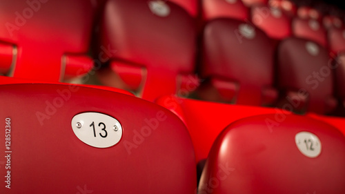 Unlucky Number Thirteen On Empty Red Chair photo
