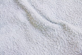 Closeup view of towel. Fluffy white background