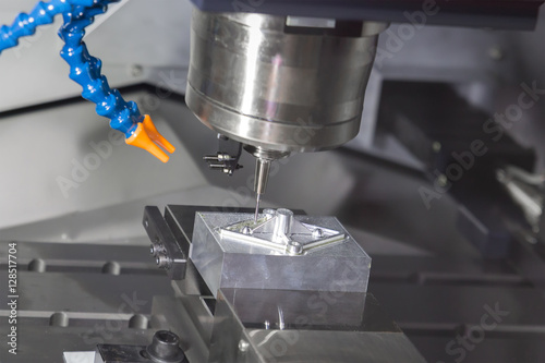 High precision CNC machining center working, operator machining