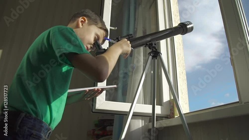 The Boy Looks in the Telescope Through an Open Window