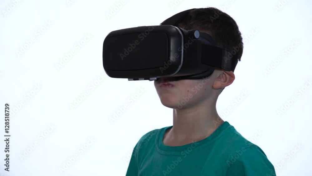 The Boy in the Virtual Reality Device on a White Background The Boy in the Virtual Reality Device on a White Background