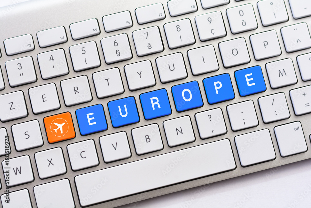 EUROPE writing on white keyboard with a aircraft sketch
