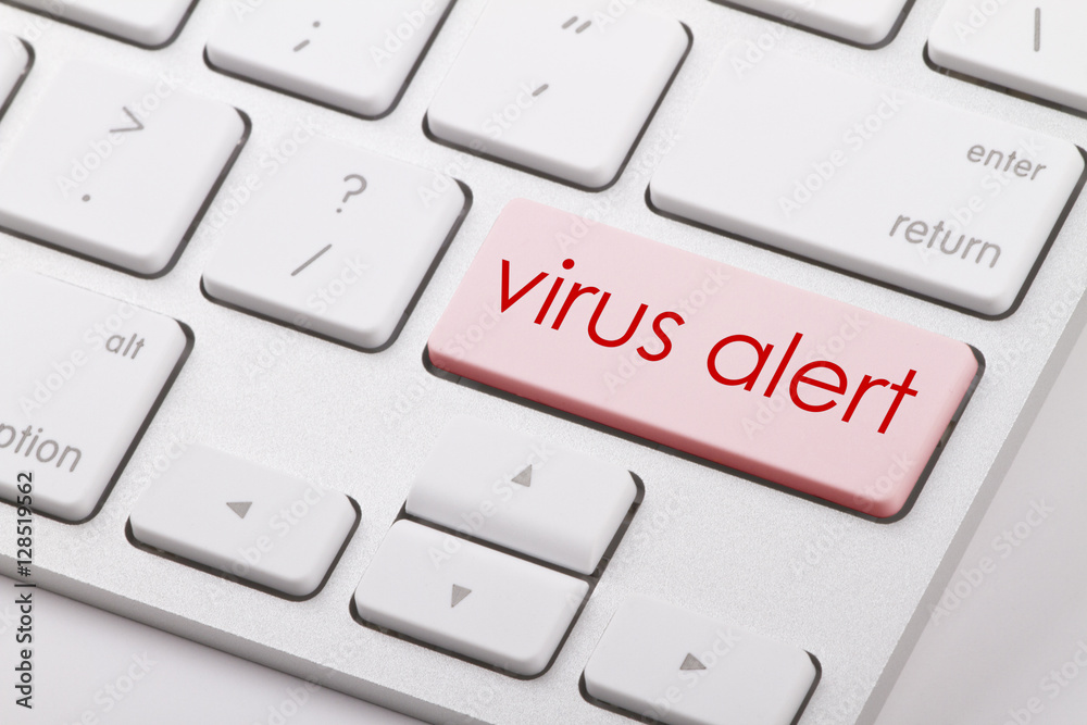 Virus alert word written on computer keyboard. Virus alert word written on computer keyboard.