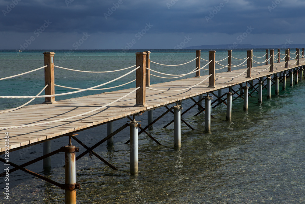 Obraz premium Long wooden pier into the sea. El Gouna. Egypt.