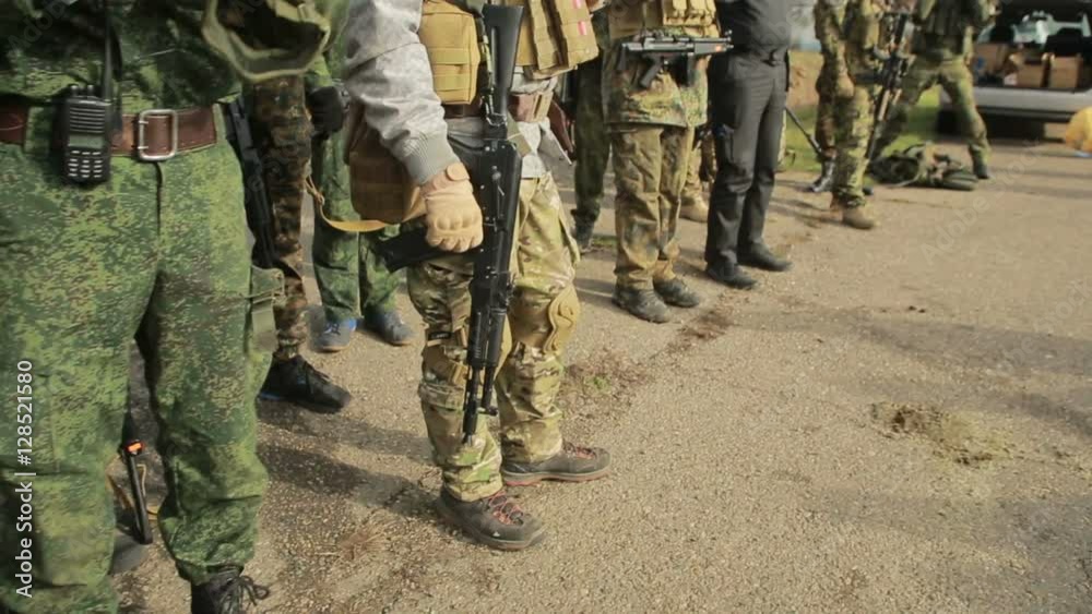 militias are fighting. Men in camouflage with guns and playing airsoft. war