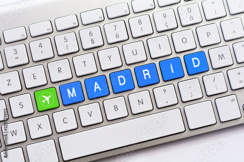 MADRID writing on white keyboard with a aircraft sketch