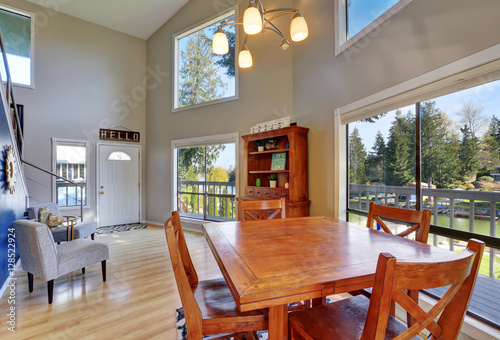 Open concept dining room with rustic table set.